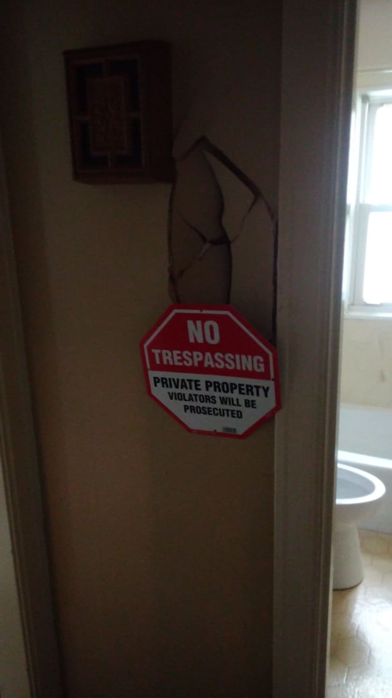 A hole in the hallway wall